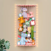 GGUO corner stuffed animal storage net in pink neatly organizing plush toys
