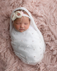 Giggle Angel newborn wrap with pearl embellishments for elegant photos.
