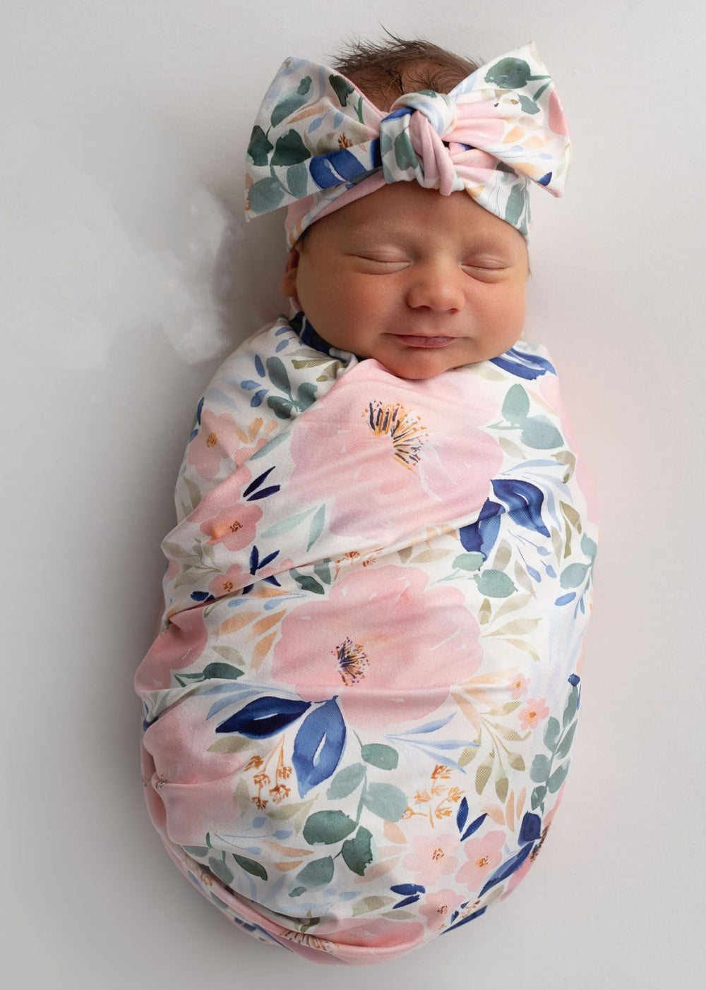 Giggle Angel swaddle blanket in floral print for cozy, secure newborn wrapping