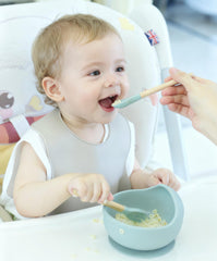Ginbear baby feeding spoon with beech handle for gentle self-feeding.