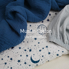 Gllquen nest-friendly sheets in nursery offer cozy sleeping surface.