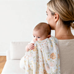 GLLQUEN BABY muslin swaddle texture close-up, showcasing soft cotton weave.