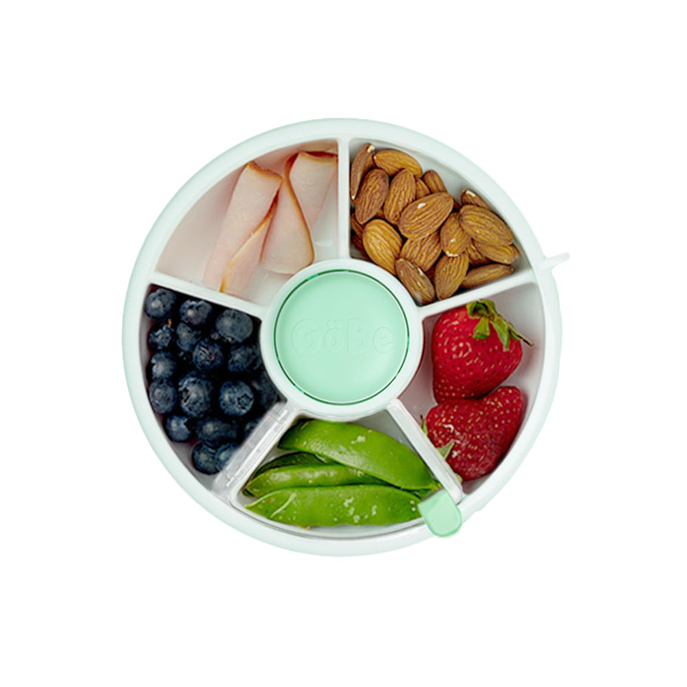 GoBe Kids snack spinner mint green, portable 5-compartment container for on-the-go snacks.