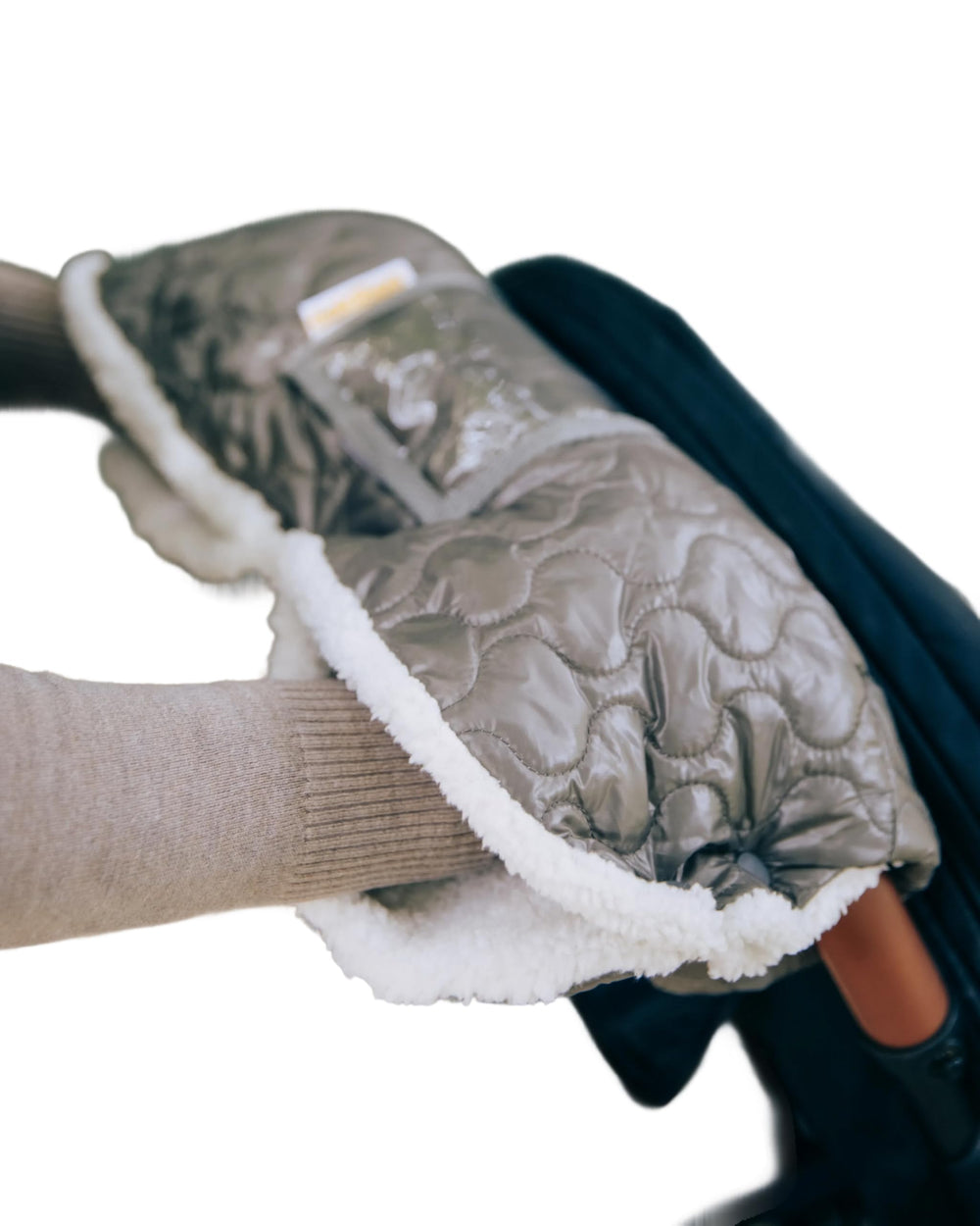 GoldBug stroller muff outer fabric close-up shows durable winter protection.