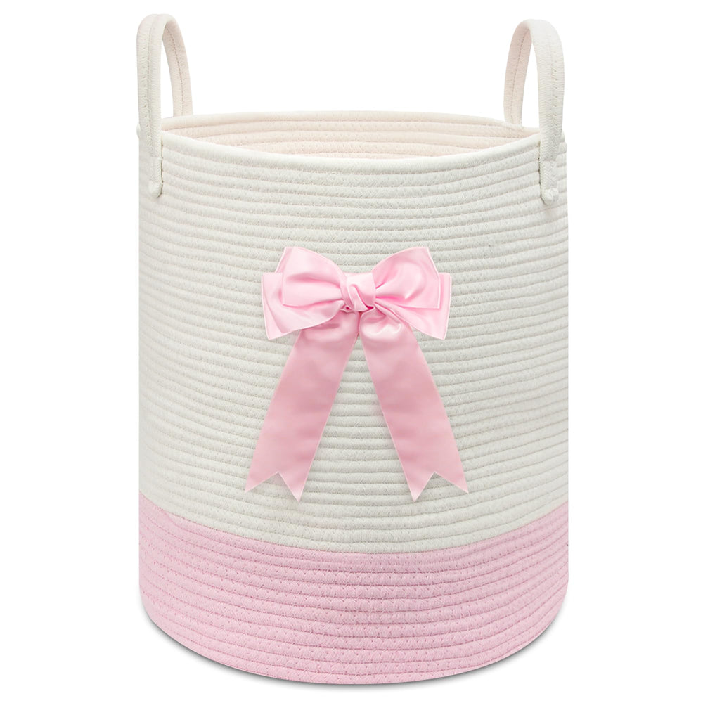 Goodheim pink woven laundry hamper with bow for nursery storage and clothes.