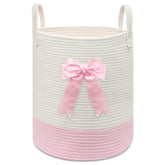 Goodheim pink woven laundry hamper with bow for nursery storage and clothes.