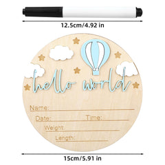 Gosknor Hello World blue sign shown as a birth photo prop.