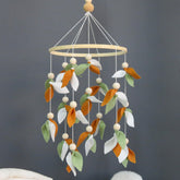 Goukurlsma Leaf Crib Mobile features forest design with leaves and beads for calming visual engagement.