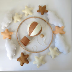 Goukurlsma natural beech wood base supports a sturdy, decorative crib accessory.