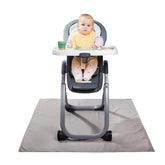 Graco splat mat under high chair protects floors from spills and messes.