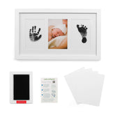 Green Pollywog baby handprint frame close-up; elegant white finish.