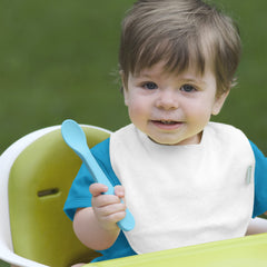 Green Sprouts Stay-Dry Bib close-up shows adjustable Velcro closure for easy on/off