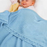 Grewear baby knit blanket with scallop border for cozy snuggles and all-season warmth.