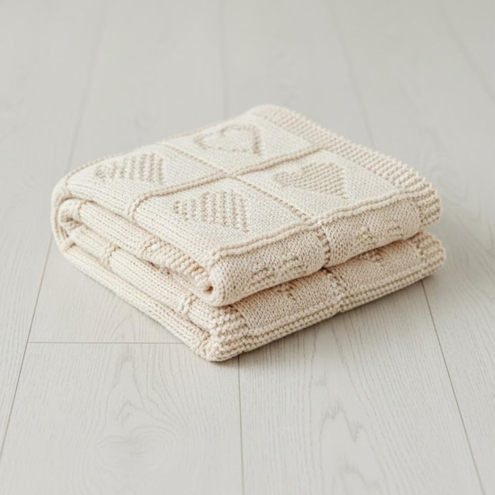 Grewear baby knit cotton blanket cream heart texture close-up, soft warmth for delicate skin.