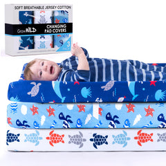 Grow Wild ocean-themed cover complements matching crib sheets for a coordinated nursery.