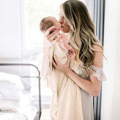 GRSSDER baby bow accessory complements soft swaddle for stylish photos.