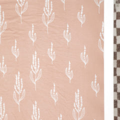 GRSSDER crib sheet fitted on mattress demonstrates snug fit and 9-inch pocket