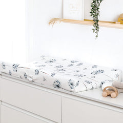 GRSSDER changing pad cover in Watercolor Dandelion pattern adds cozy nursery decor.