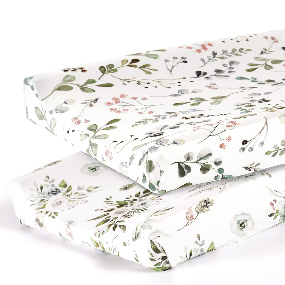GRSSDER watercolor rose cover on a 32x16 changing pad, snug and stylish.
