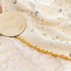Gunnaicat baby blanket ready for swaddling, with a soft polyester back for added warmth.