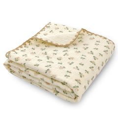 Gunnaicat double-layered muslin blanket with flowers print for gentle swaddling and nursery comfort.