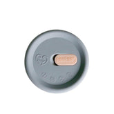 Haakaa cap over pump top keeps milk clean and spill-free between uses.