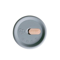 Haakaa cap over pump top keeps milk clean and spill-free between uses.
