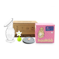 Haakaa New Mum Starter Pack 150ml silicone breast pump in action for discreet expression