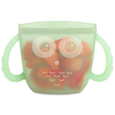 Haakaa Oscar Owl snack container with dual handles for easy toddler grip and mess-free snacking.