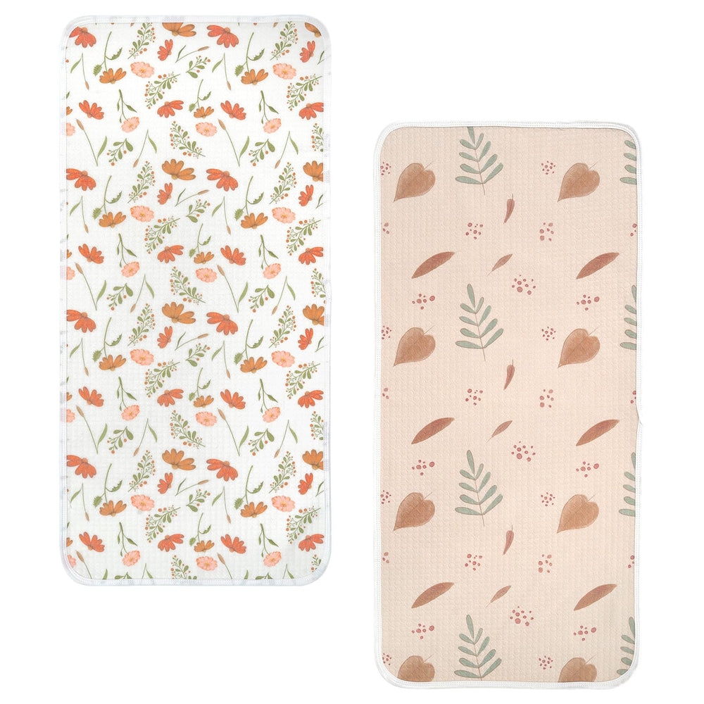 Haakaa waterproof changing pad liner with soft cotton top shows texture for gentle skin contact and surface protection.