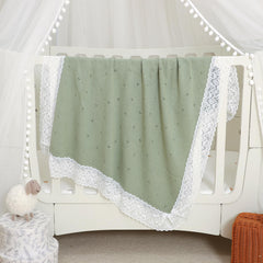 Lightweight Hadetoto baby blanket in light green for year-round coverage.