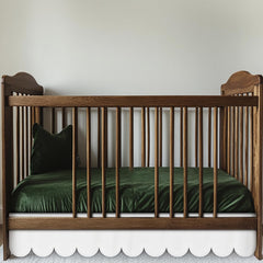 Hahafelt white scalloped crib skirt front view shows timeless design