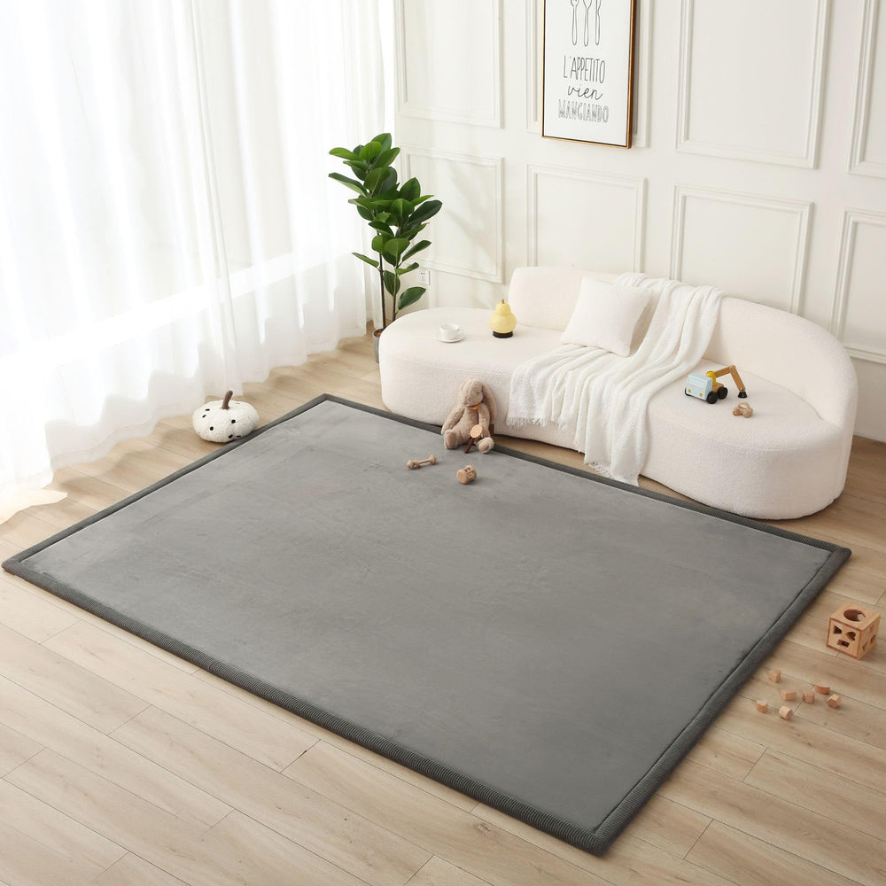 Hakuna Matte CloudSoft baby play mat 80x110 inches in dark gray supports tummy time and crawling.