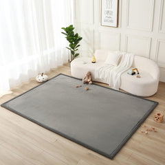Hakuna Matte CloudSoft baby play mat 80x110 inches in dark gray supports tummy time and crawling.