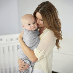 HALO Sleepsack Swaddle one-arm-out supports self-soothing while swaddled