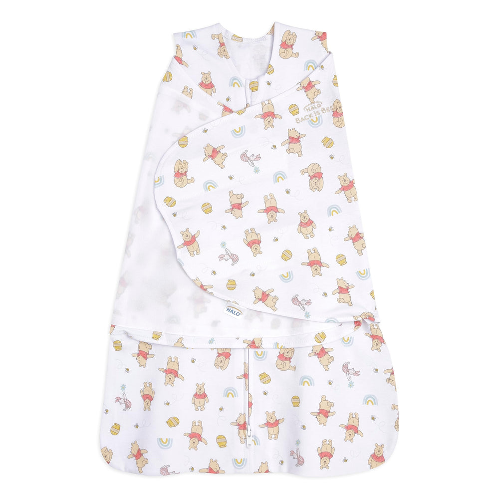 Halo Winnie Rainbows Sleepsack Swaddle in 100% cotton for snug, secure sleep.