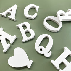 HANWER wooden letters spell HOME or HELLO for events.
