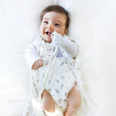Happiest Baby Sleepea Comforter Swaddle worn-stage image emphasizes snug warmth and secure fit