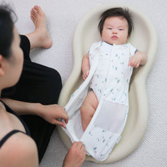 Happiest Baby Sleepea medium size shown for growing baby comfort.