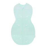 Happiest Baby Sleepea teal stars swaddle on baby, secure and soft