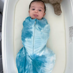 Quiet Velcro closure keeps baby securely swaddled with minimal noise
