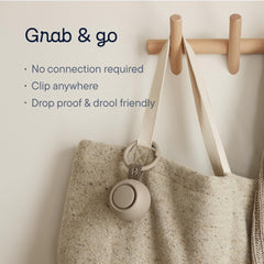 Hatch Go clipped to a stroller with carry-ring for hands-free use