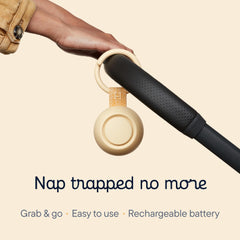 Hatch Go clipped to a stroller for easy travel and quick naps.