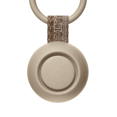 Hatch Go portable sound machine clipped to a stroller for on-the-go sleep