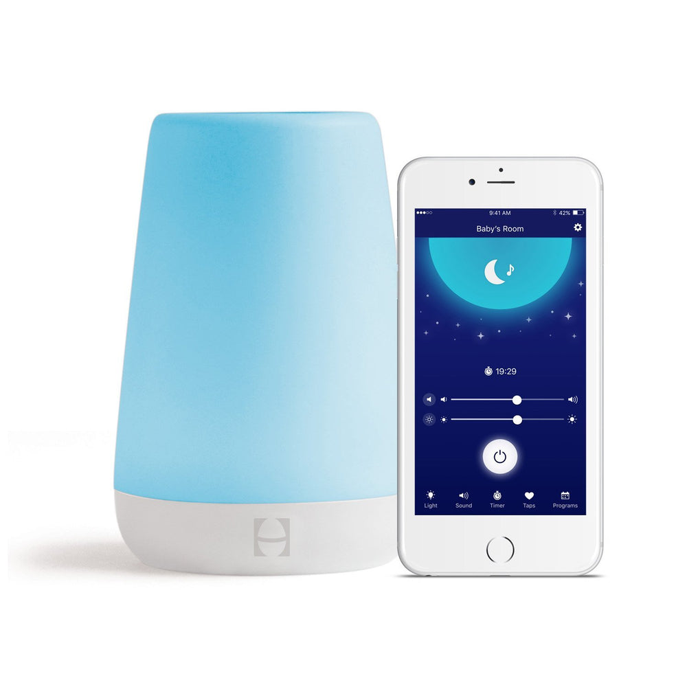 Hatch Rest Gen 1 baby sound machine on a nightstand providing soothing sleep cues.