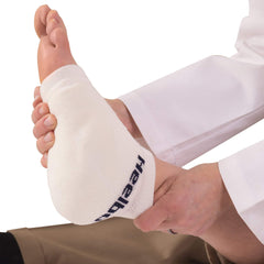 Heelbo foam pad close-up reveals contoured cushioning for protection.