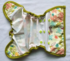 Hibaby Bloom diaper cover worn on baby for flexible sizing.