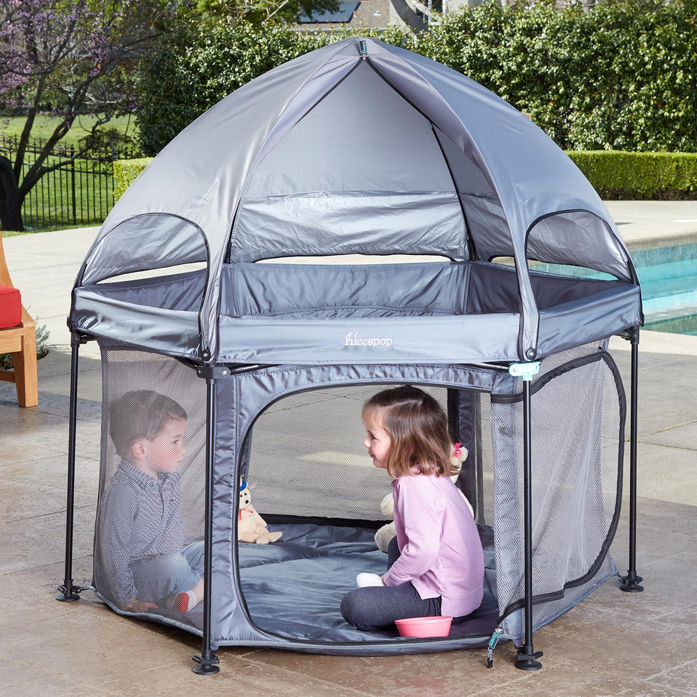 hiccapop PlayPod 53-inch outdoor playpen with canopy providing shade and space