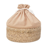 HODAKJUE round drawstring basket keeps toys and blankets organized.