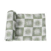 Hollyoo muslin swaddle blanket with checkered design, breathable comfort for baby